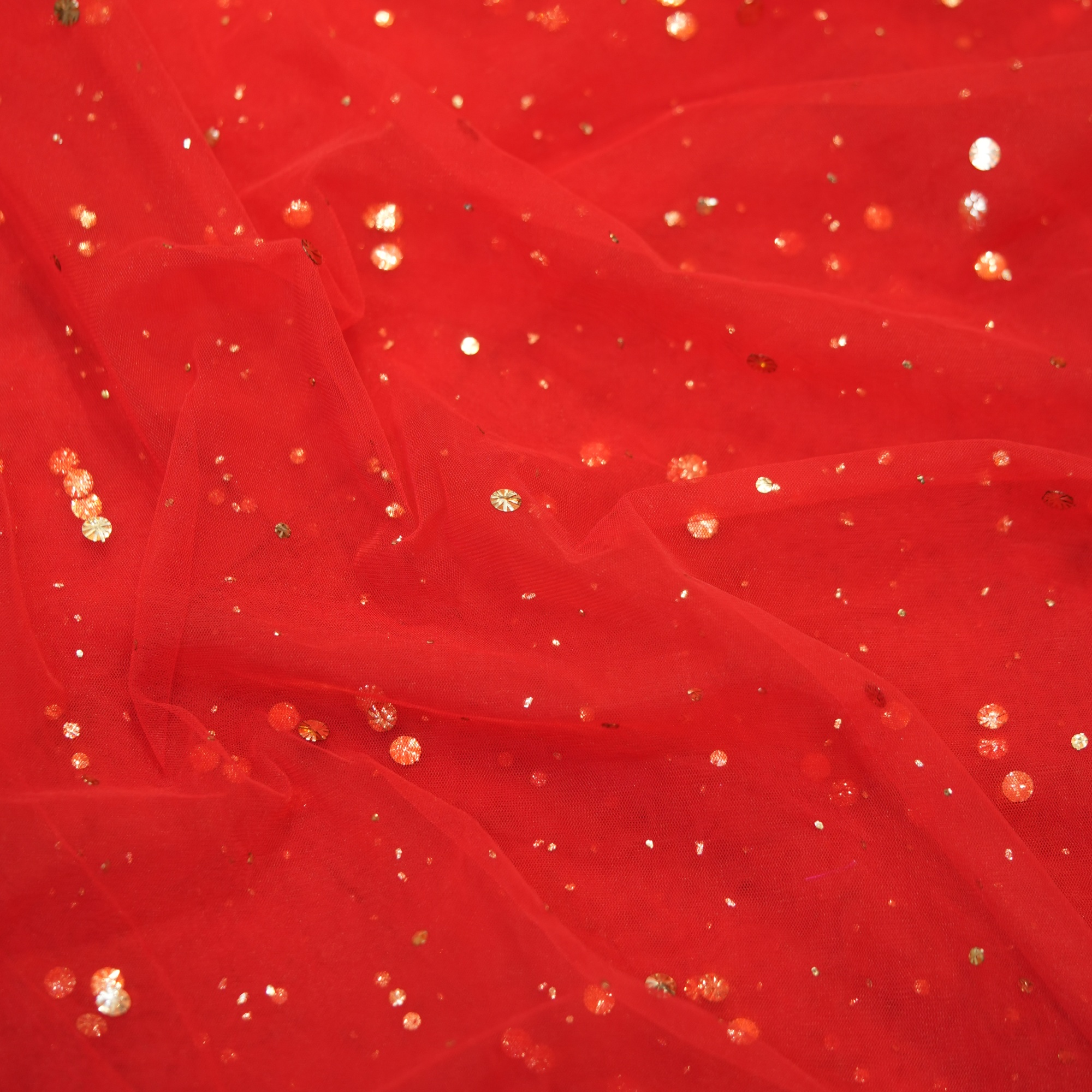 Red net fabric with scattered raindrop-style mukaish embroidery