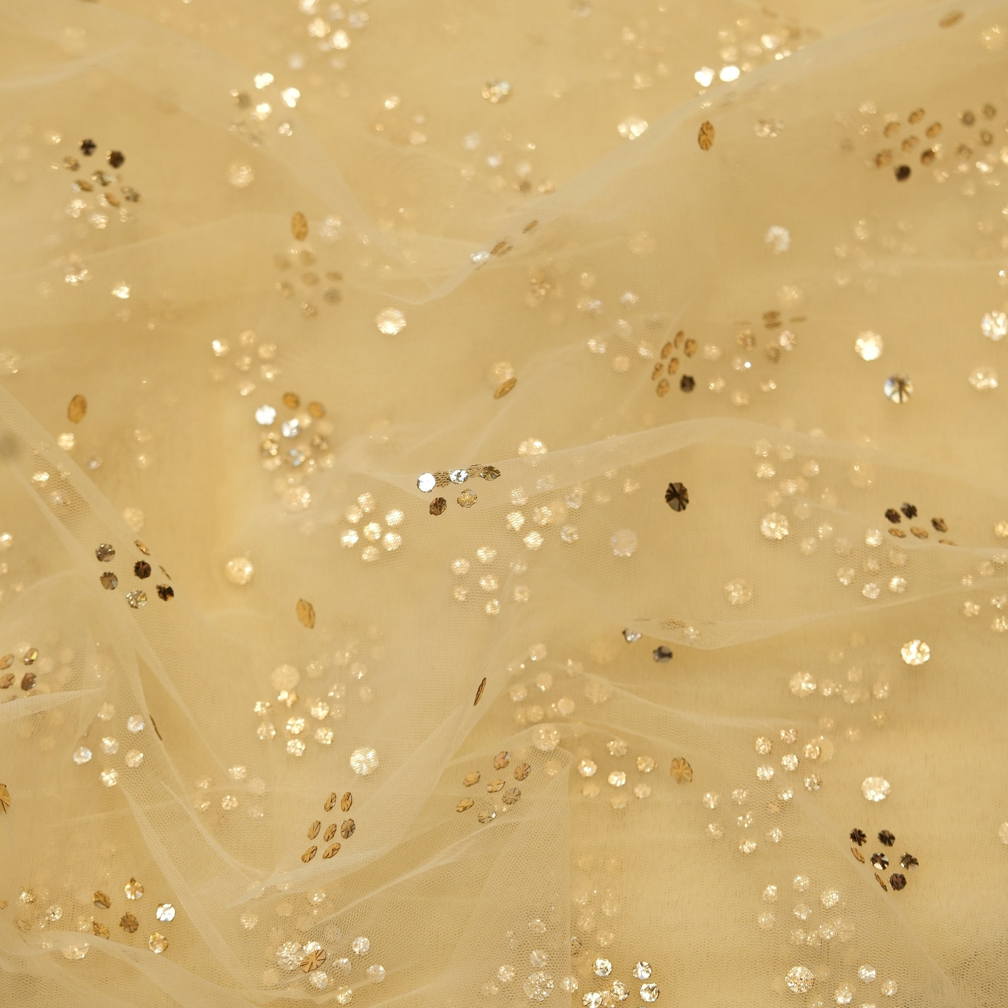 Ivory beige net fabric with floral Mukaish dot clusters in gold and silver