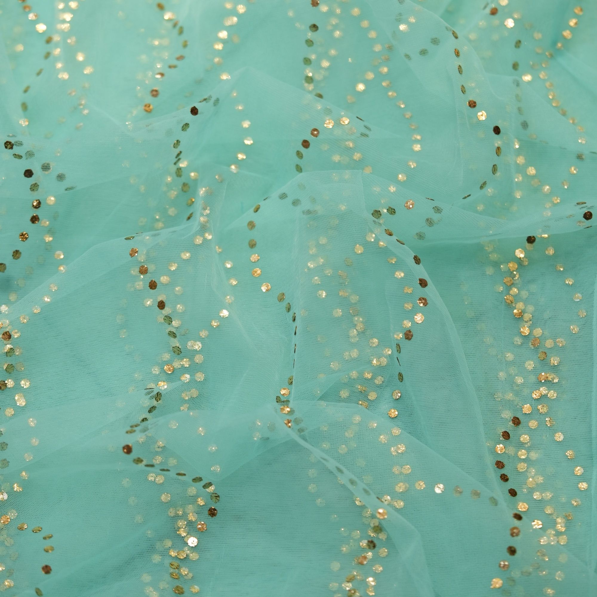 Aqua blue net fabric with Mukaish wave-line pattern in gold and silver dots