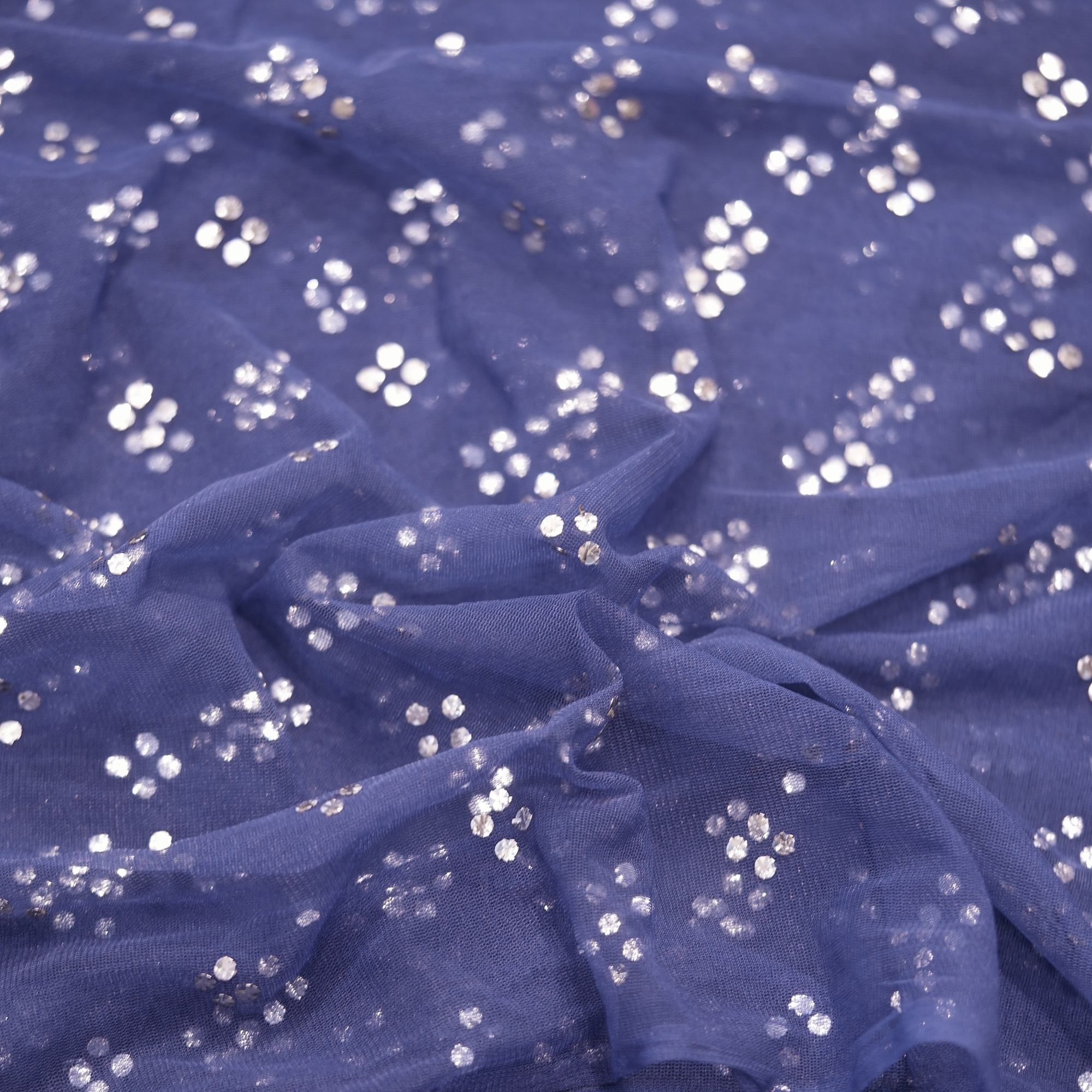Navy blue net fabric with hand Mukaish foil work in diagonal clustered pattern