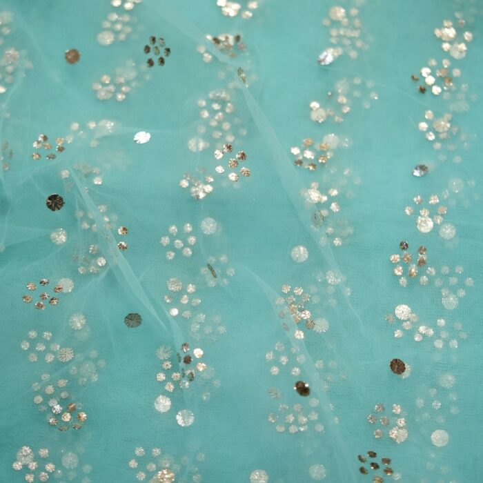 Turquoise net fabric with floral Mukaish foil work in cascading dotted vines
