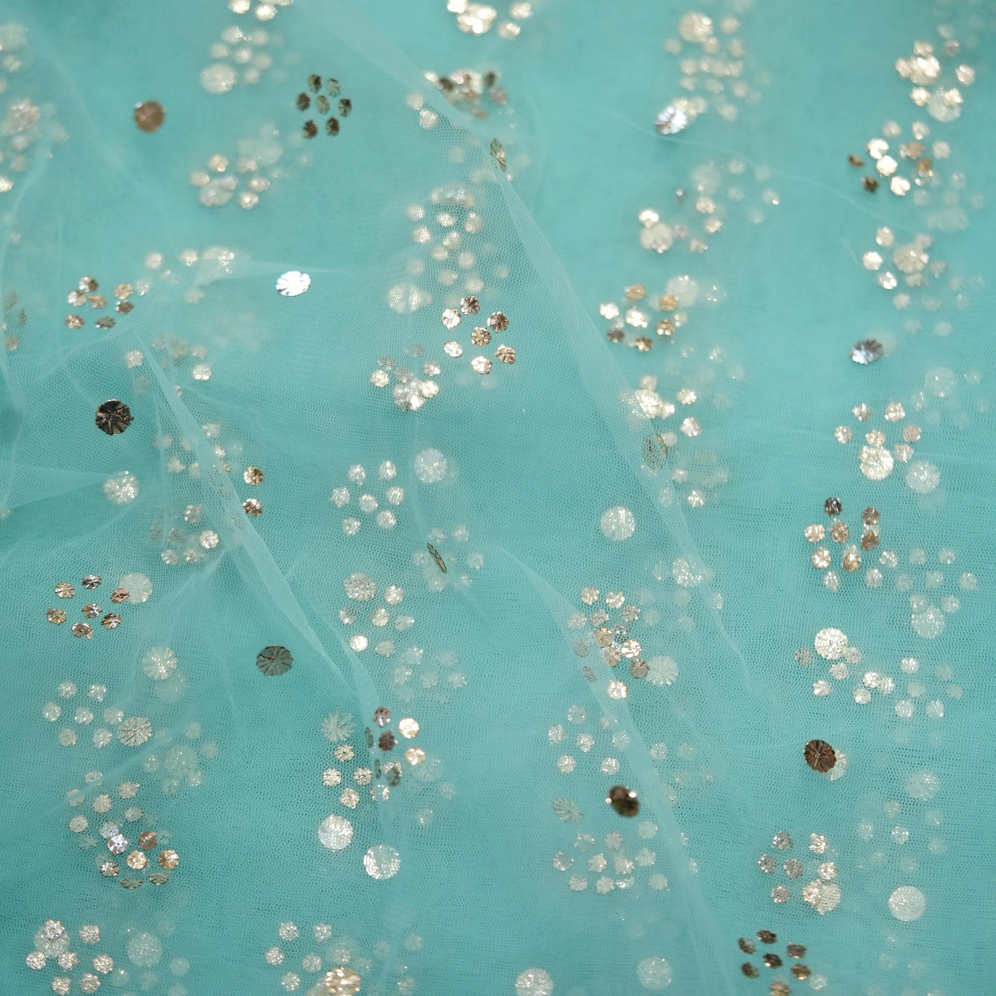 Turquoise net fabric with floral Mukaish foil work in cascading dotted vines