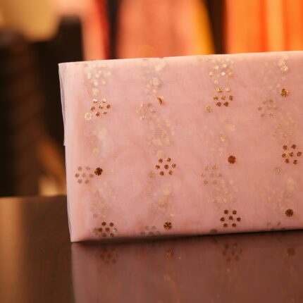 Blush pink net fabric with golden and silver Mukaish floral foil pattern