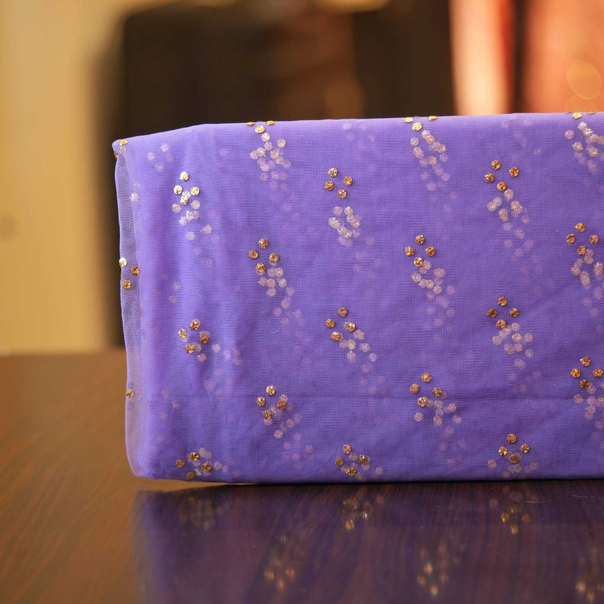 Violet net fabric with cascading gold Mukaish work in vertical dot clusters