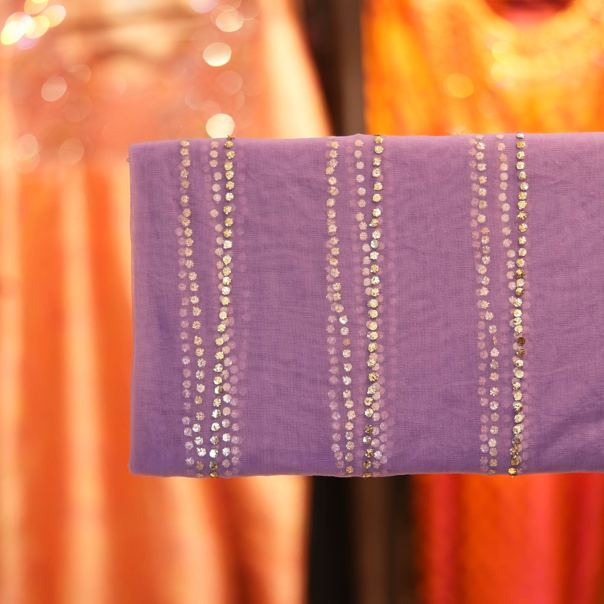 Violet net fabric featuring vertical silver Mukaish lines