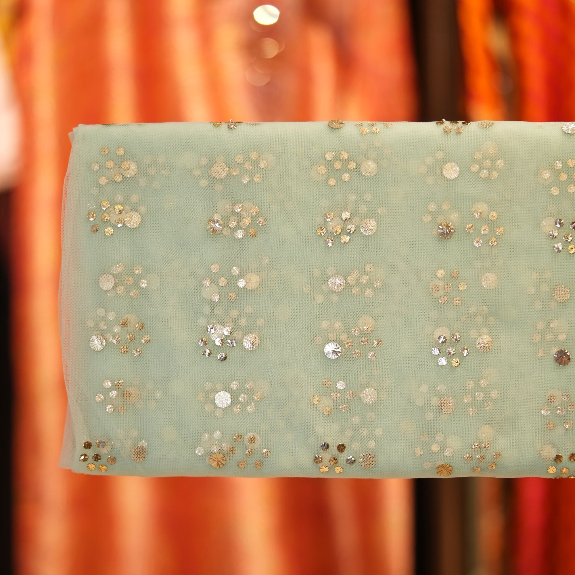 Mint green net fabric with all-over floral Mukaish foil work