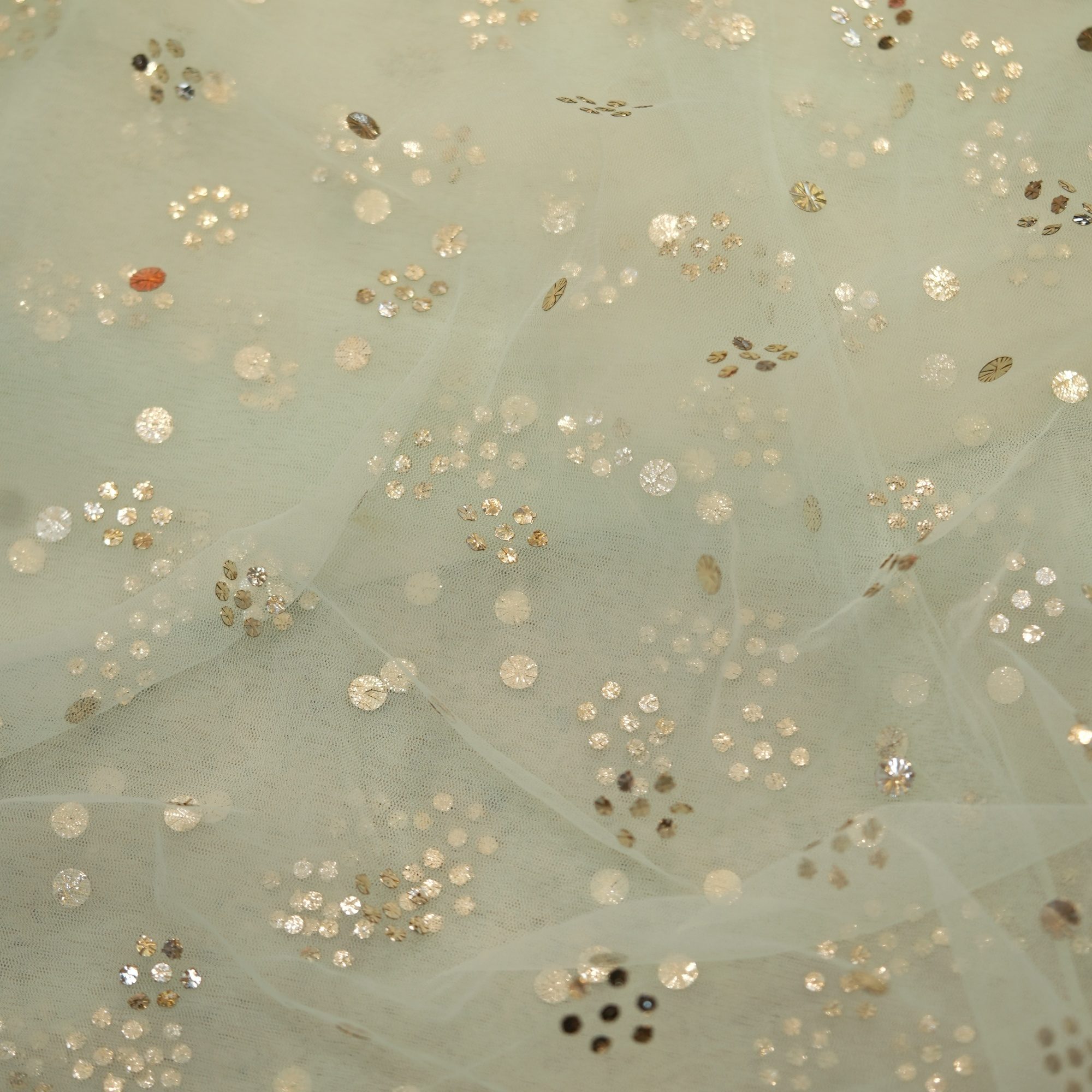 Mint green net fabric with all-over floral Mukaish foil work