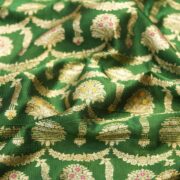 Green pure Katan silk fabric with golden zari and colorful meenakari floral motifs