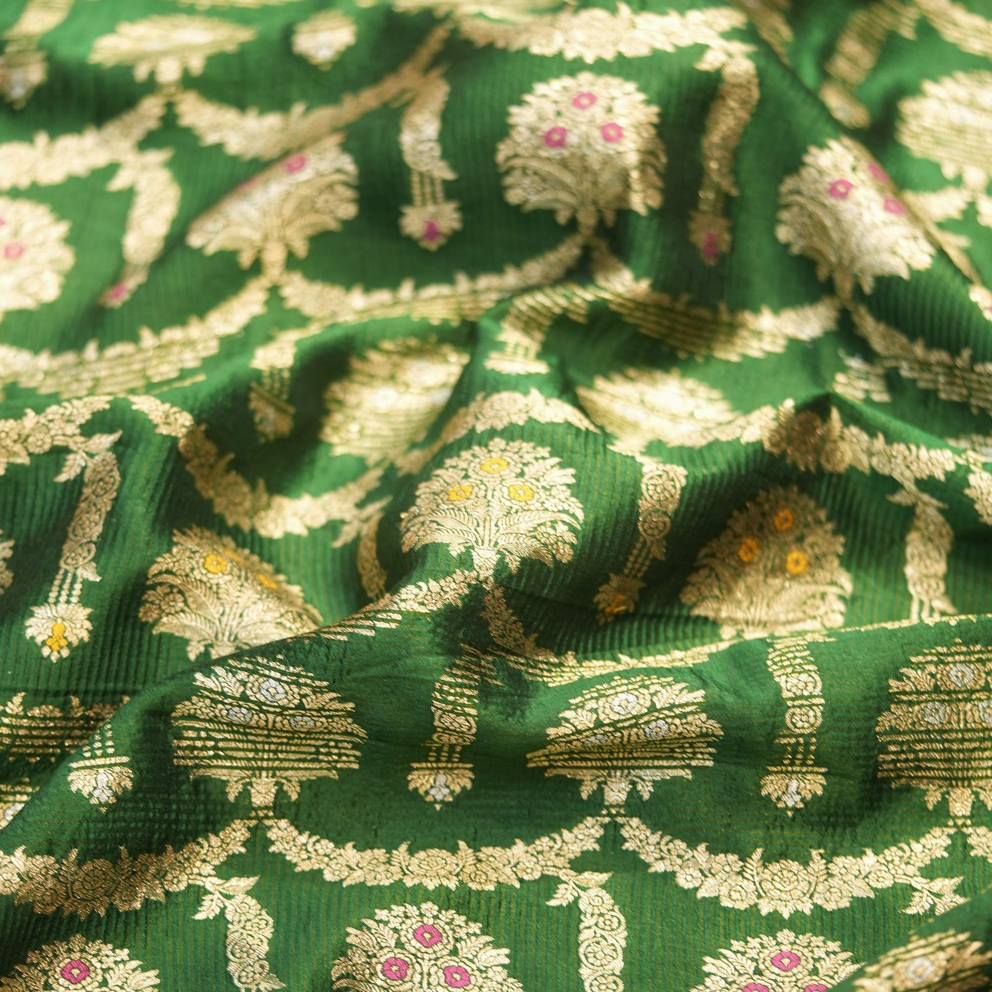 Green pure Katan silk fabric with golden zari and colorful meenakari floral motifs