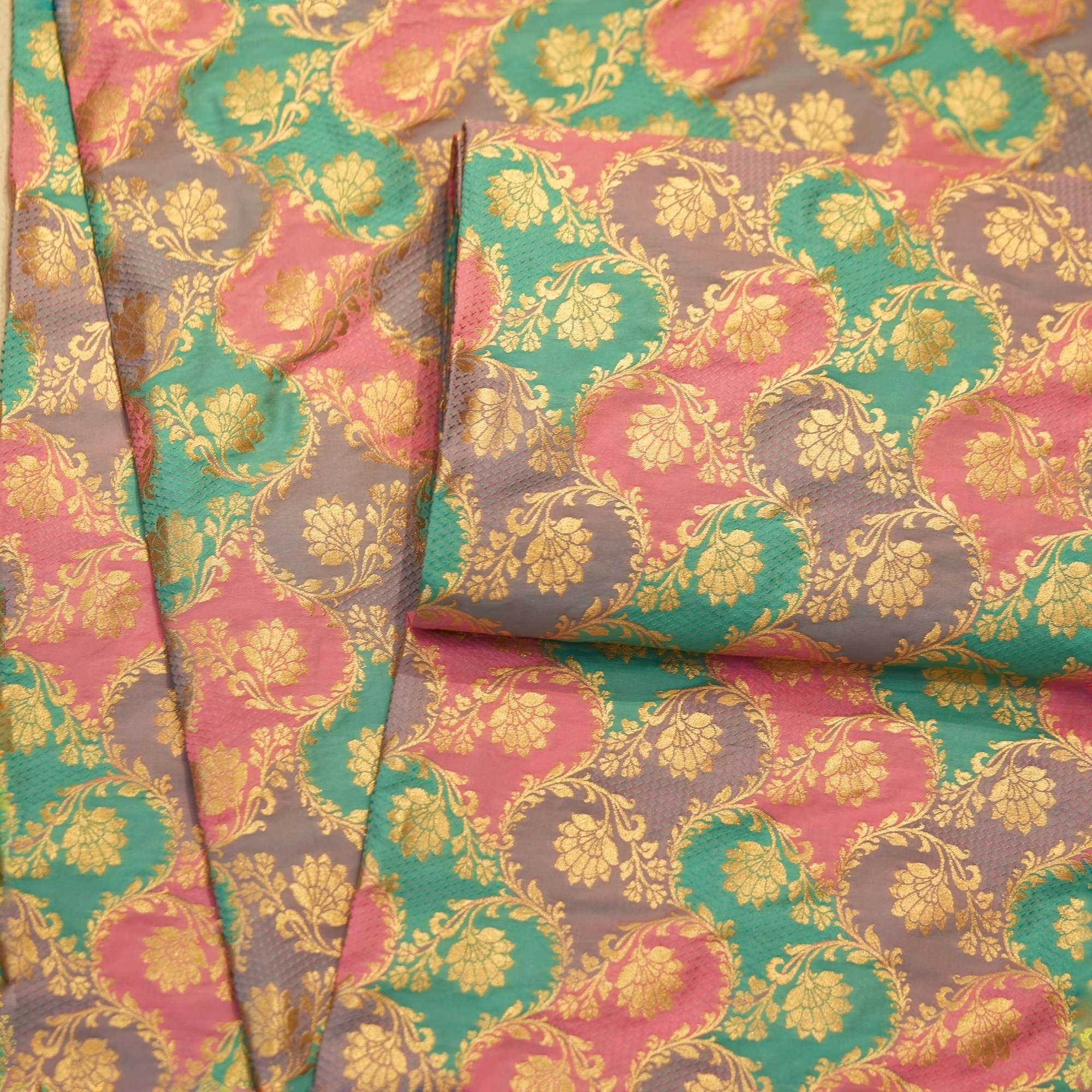 Multicolor Indian silk fabric with circular rangkaat dyeing and intricate golden zari weaving