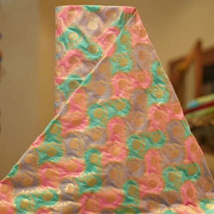 Multicolor Indian silk fabric with circular rangkaat dyeing and intricate golden zari weaving