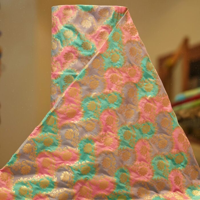 Multicolor Indian silk fabric with circular rangkaat dyeing and intricate golden zari weaving