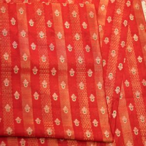 Rich red pure silk fabric with tissue jacquard stripes, golden zari weaving, and meenakari floral motifs
