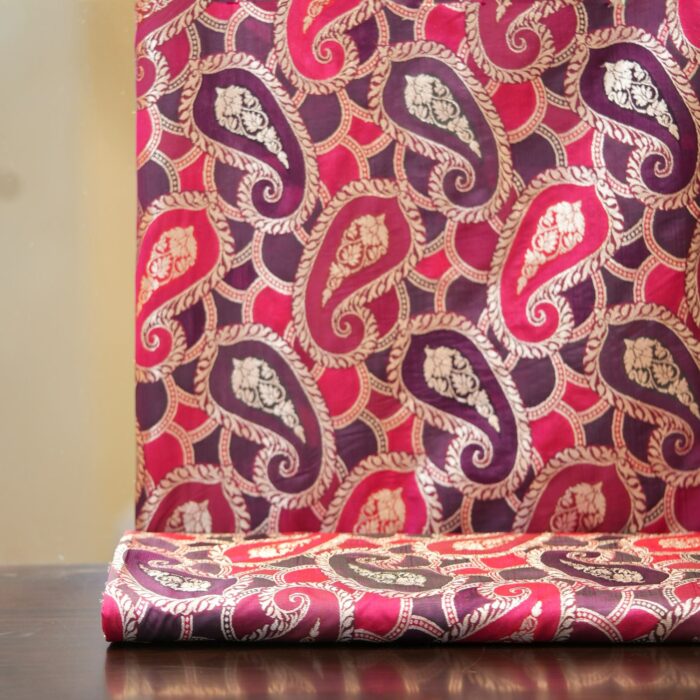 Rangkaat Indian silk fabric with bold multicolor paisley and light gold zari detailing