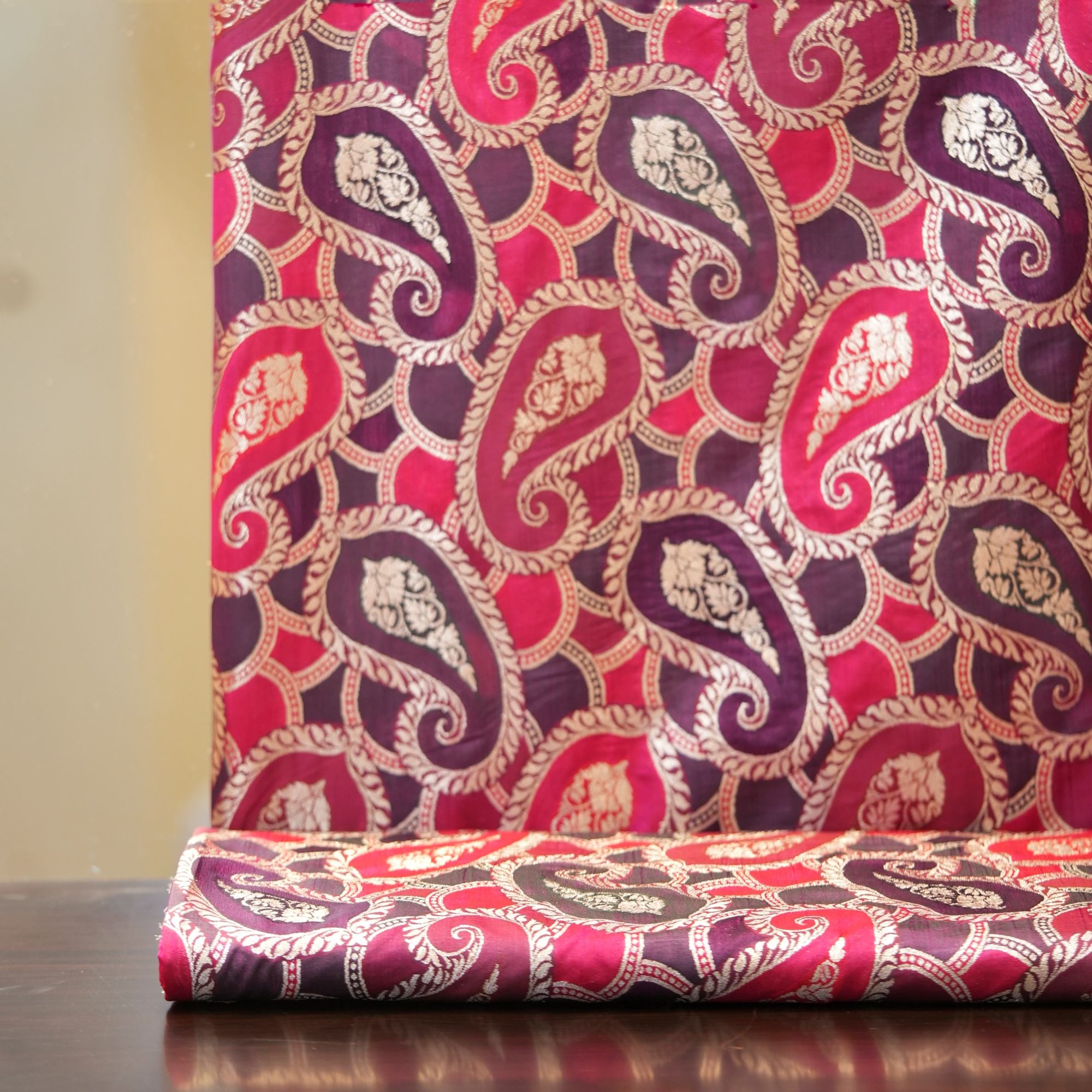 Rangkaat Indian silk fabric with bold multicolor paisley and light gold zari detailing