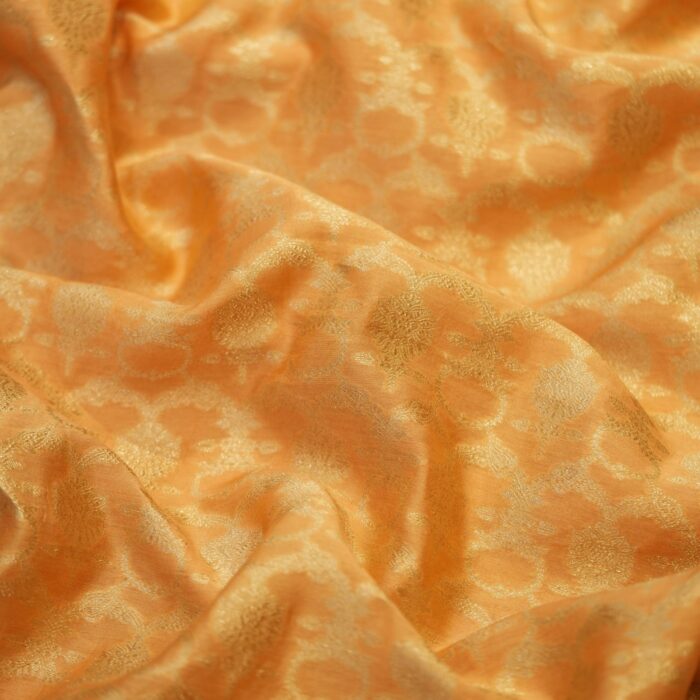 Golden yellow Katan silk fabric with floral golden zari weaving