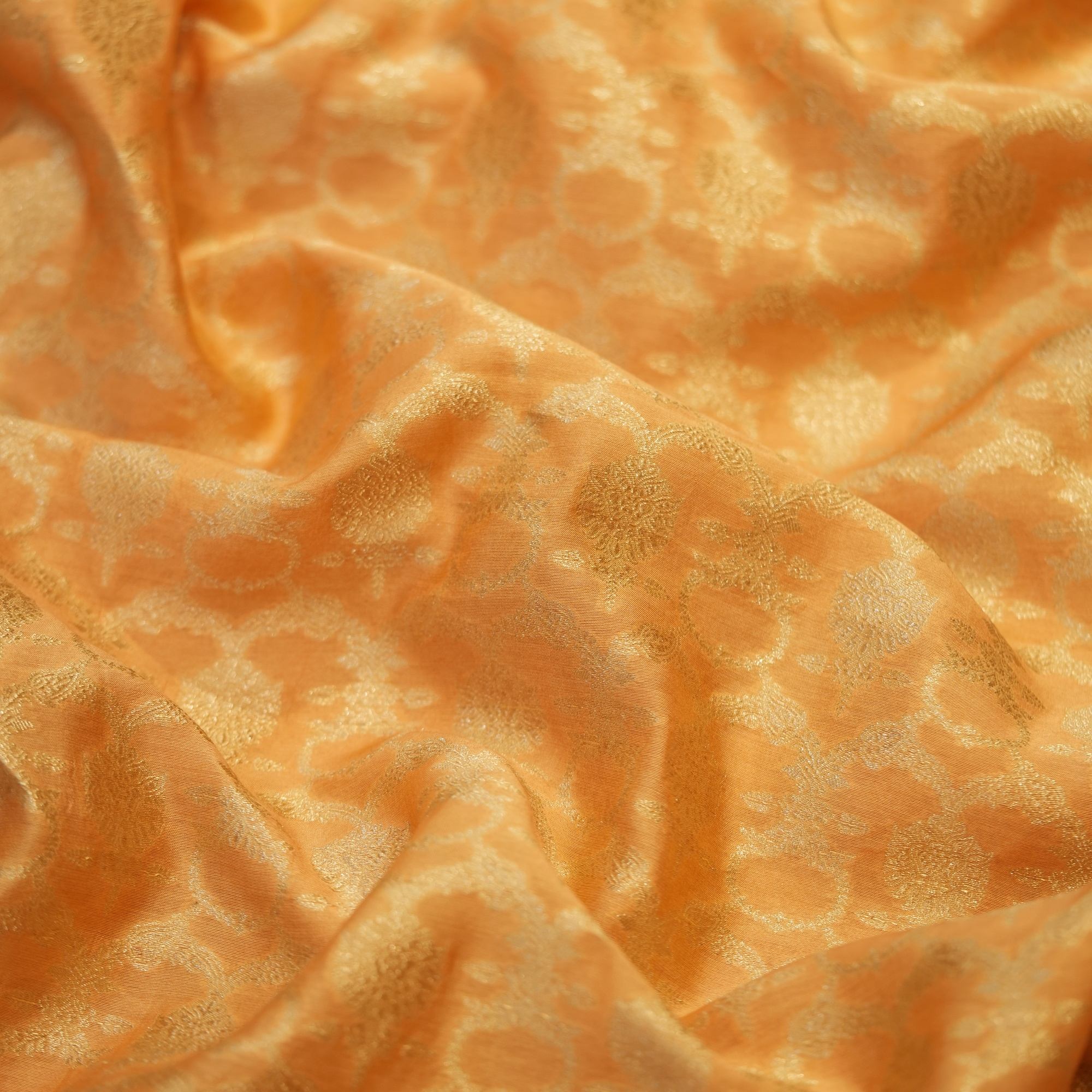 Golden yellow Katan silk fabric with floral golden zari weaving