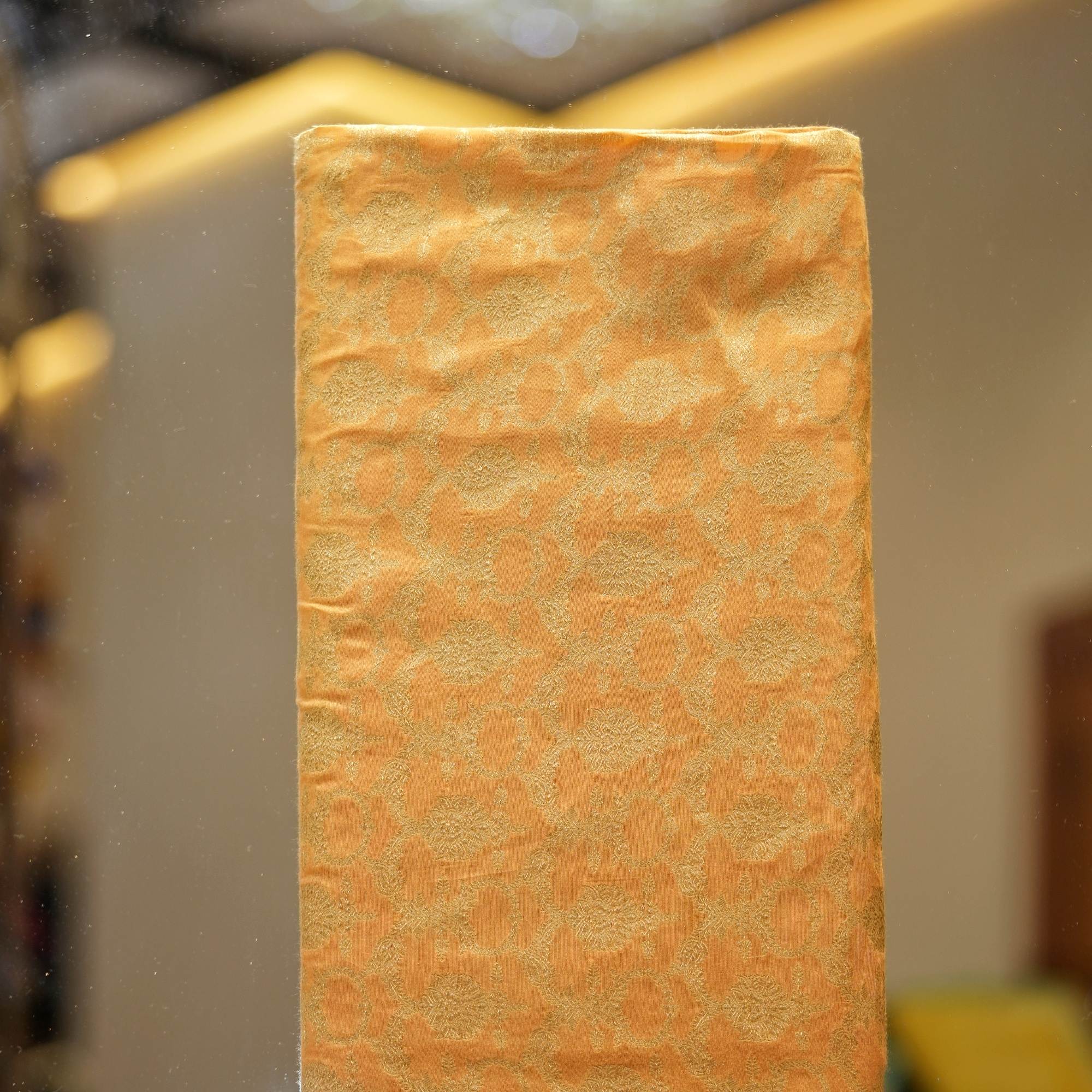 Golden yellow Katan silk fabric with floral golden zari weaving