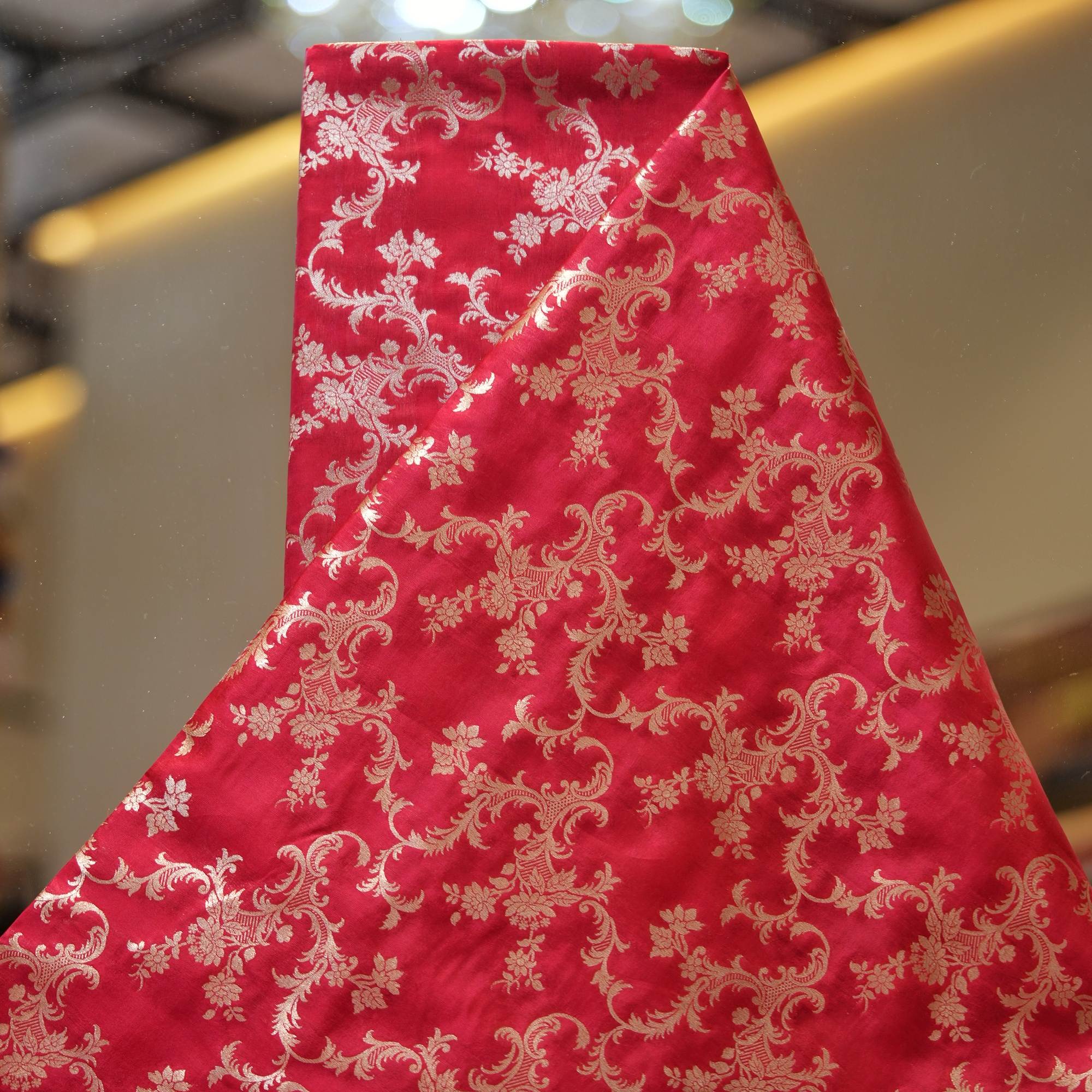 Crimson red Dupion silk with intricate floral light gold zari weaving