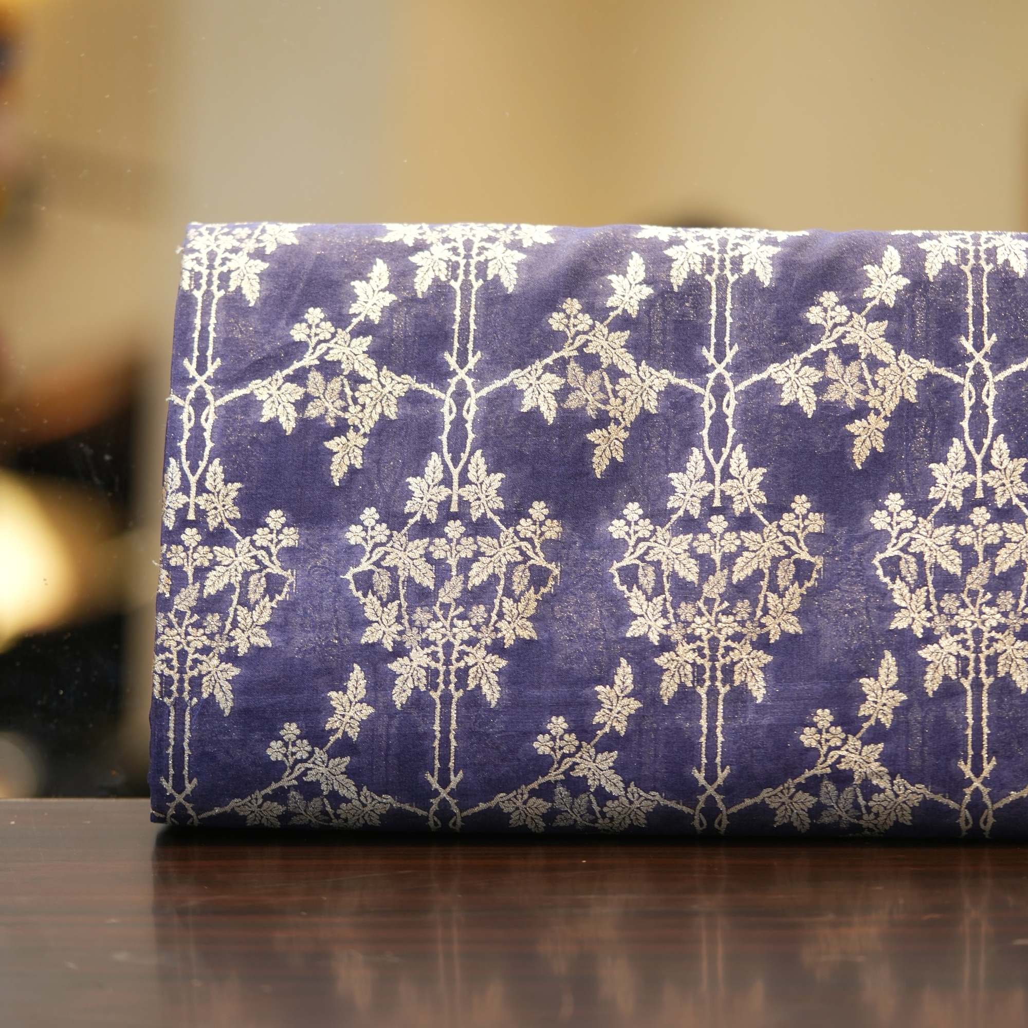 Royal blue dupion silk with light gold Zari trellis floral weaving
