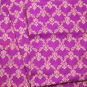 Fuchsia pink dupion silk fabric with light gold Zari chandelier-style floral weaving
