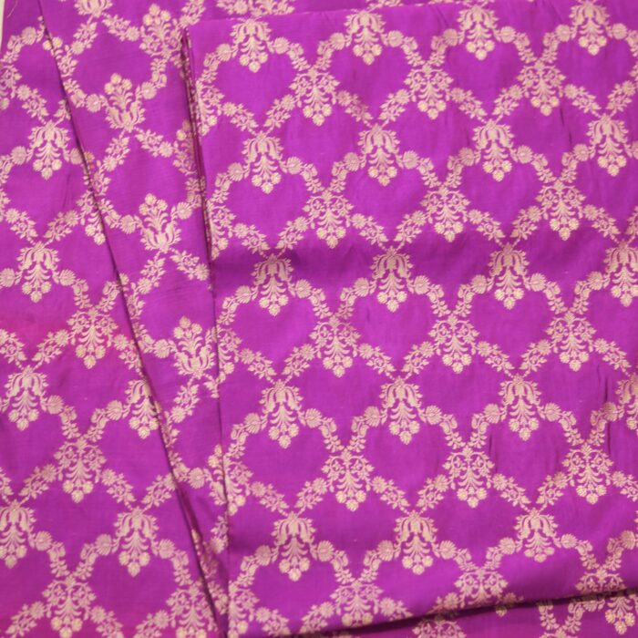 Fuchsia pink dupion silk fabric with light gold Zari chandelier-style floral weaving