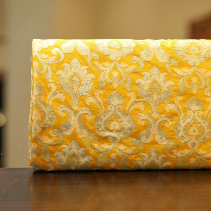 Yellow Indian silk fabric with intricate Persian-style Zari jaal in light gold