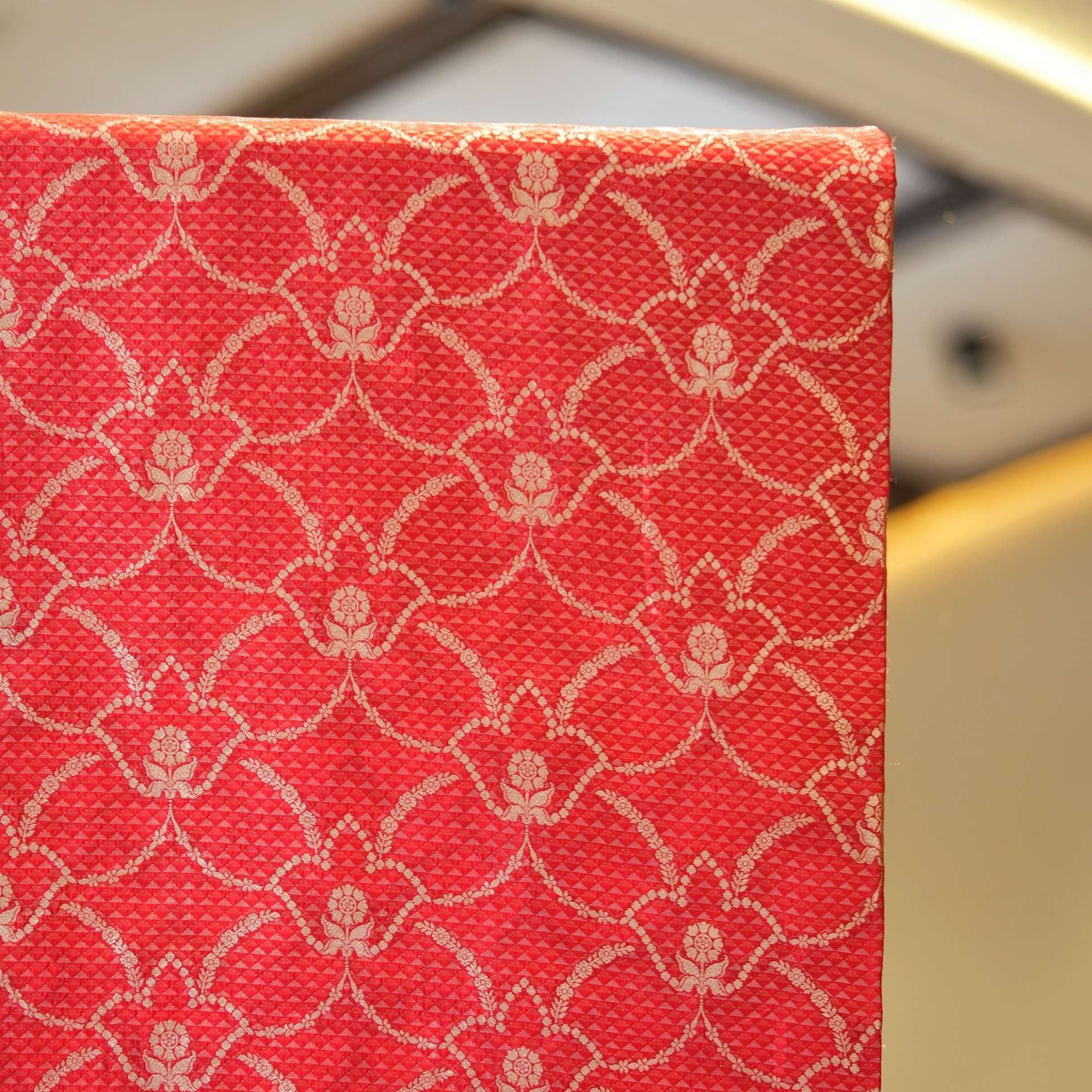 Royal red silk fabric with tissue diamond jacquard and golden Zari jaal pattern