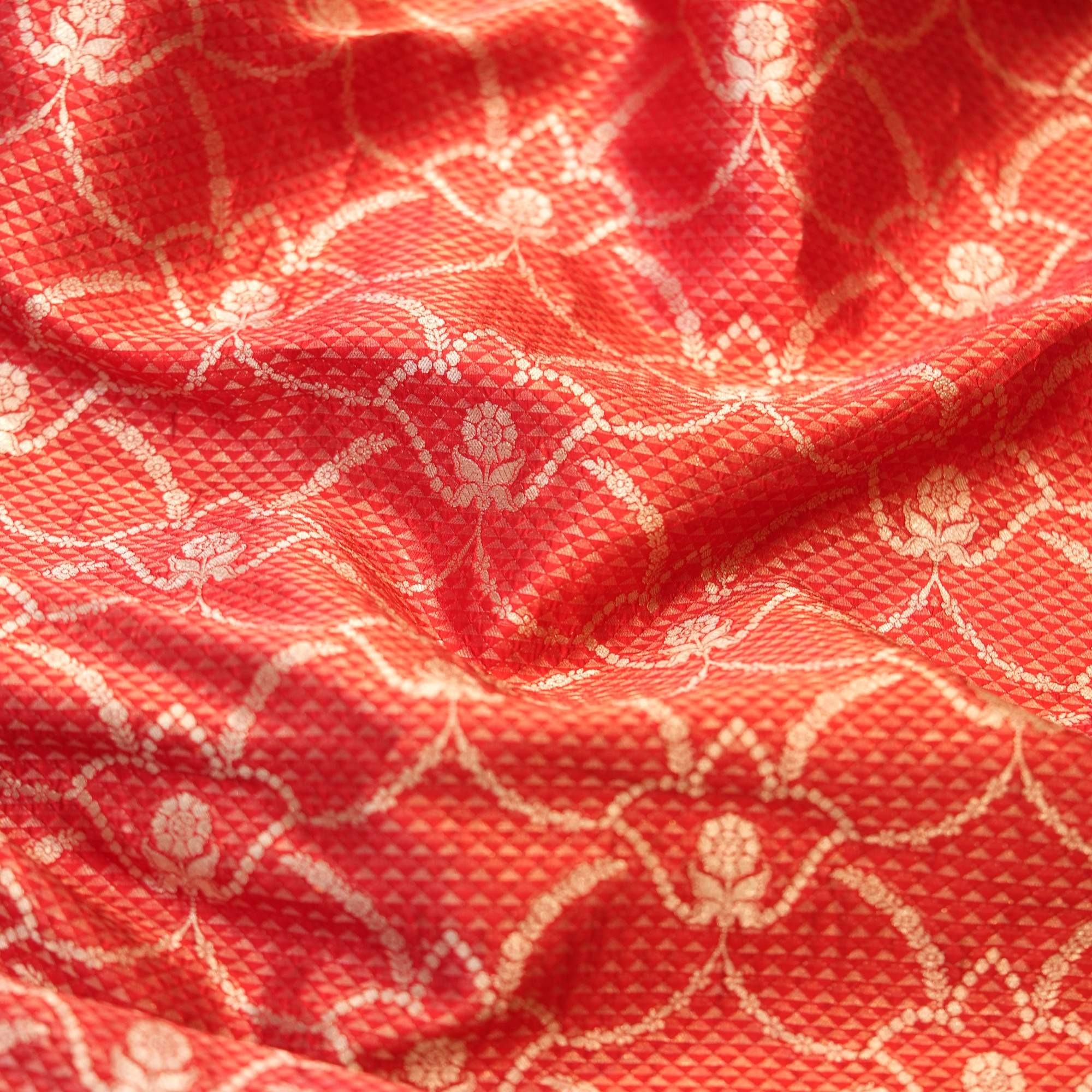 Royal red silk fabric with tissue diamond jacquard and golden Zari jaal pattern