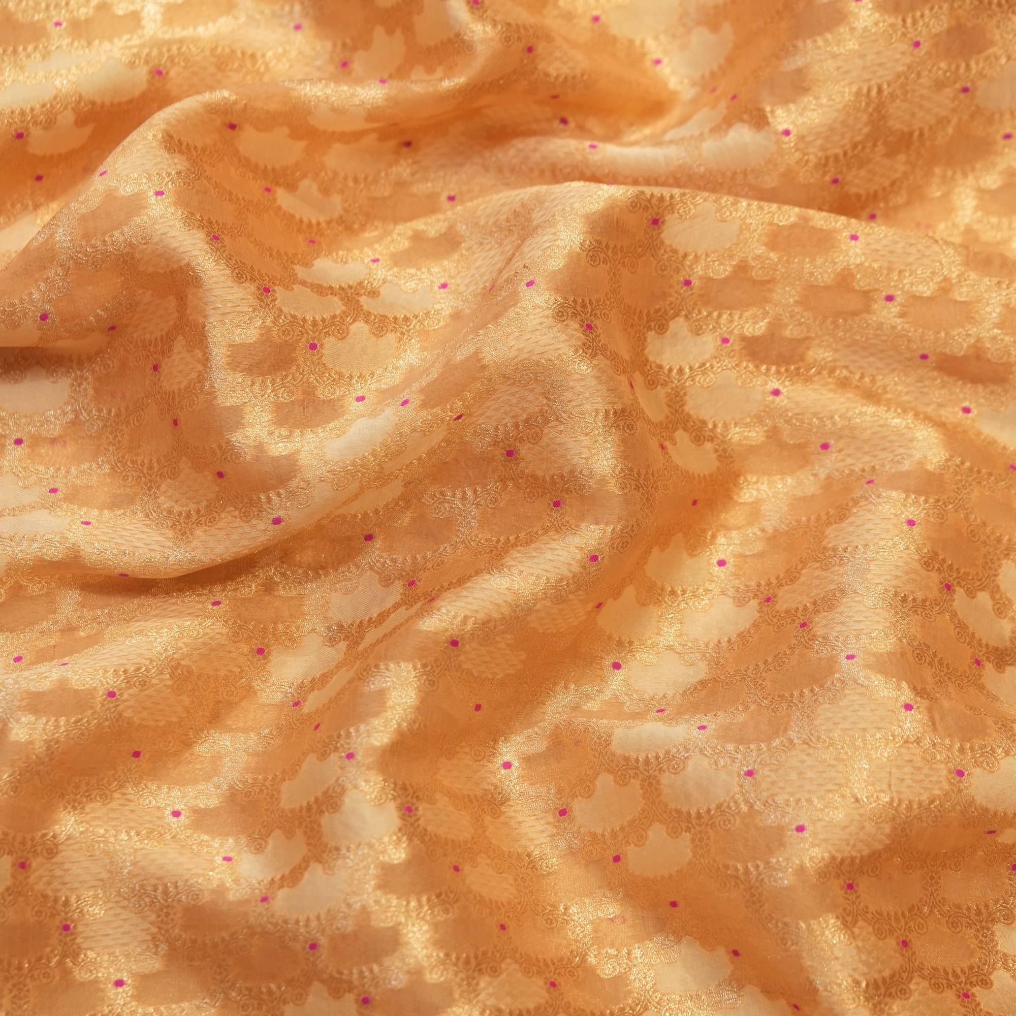 Golden tissue silk fabric with jacquard weave and pink Mina dot highlights