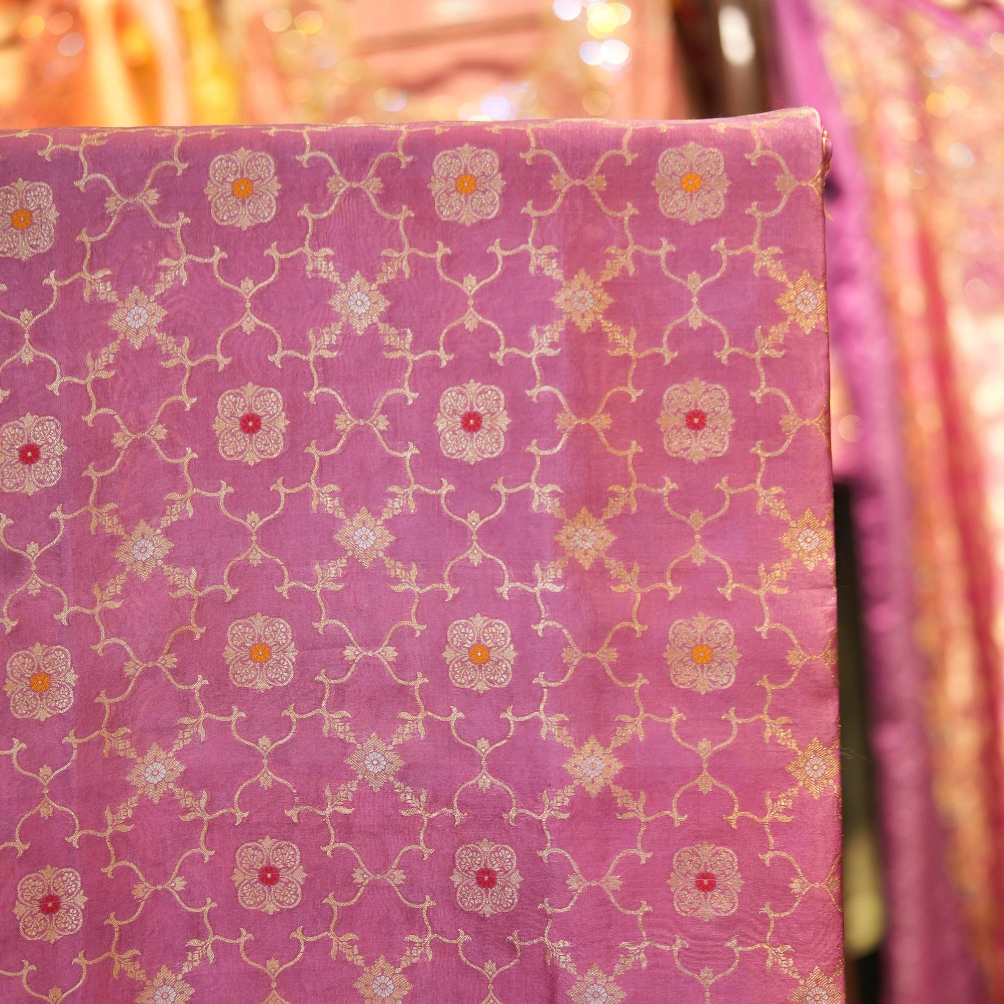Rose pink silk fabric with golden Mughal jaal and floral Meena motifs