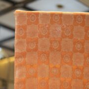 Pure royal silk fabric in peach with golden geometric textured Zari jaal weaving – Sundoori Zari Silk