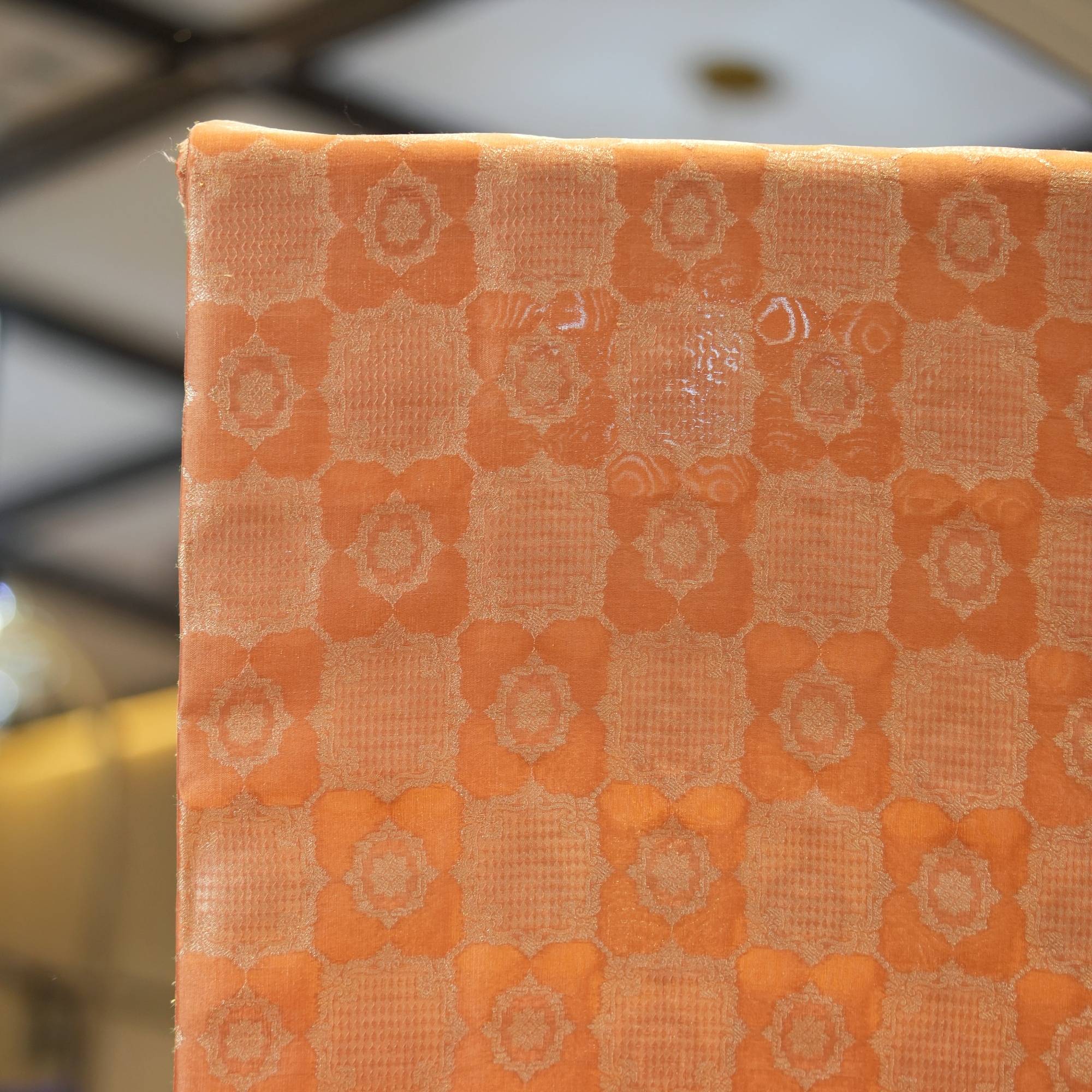 Pure royal silk fabric in peach with golden geometric textured Zari jaal weaving – Sundoori Zari Silk