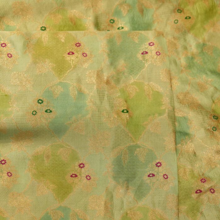 Pure hand-dyed Rangkaat silk fabric in green with golden Zari jaal and colorful Meena floral accents – Gulnaar-e-Rangkaat