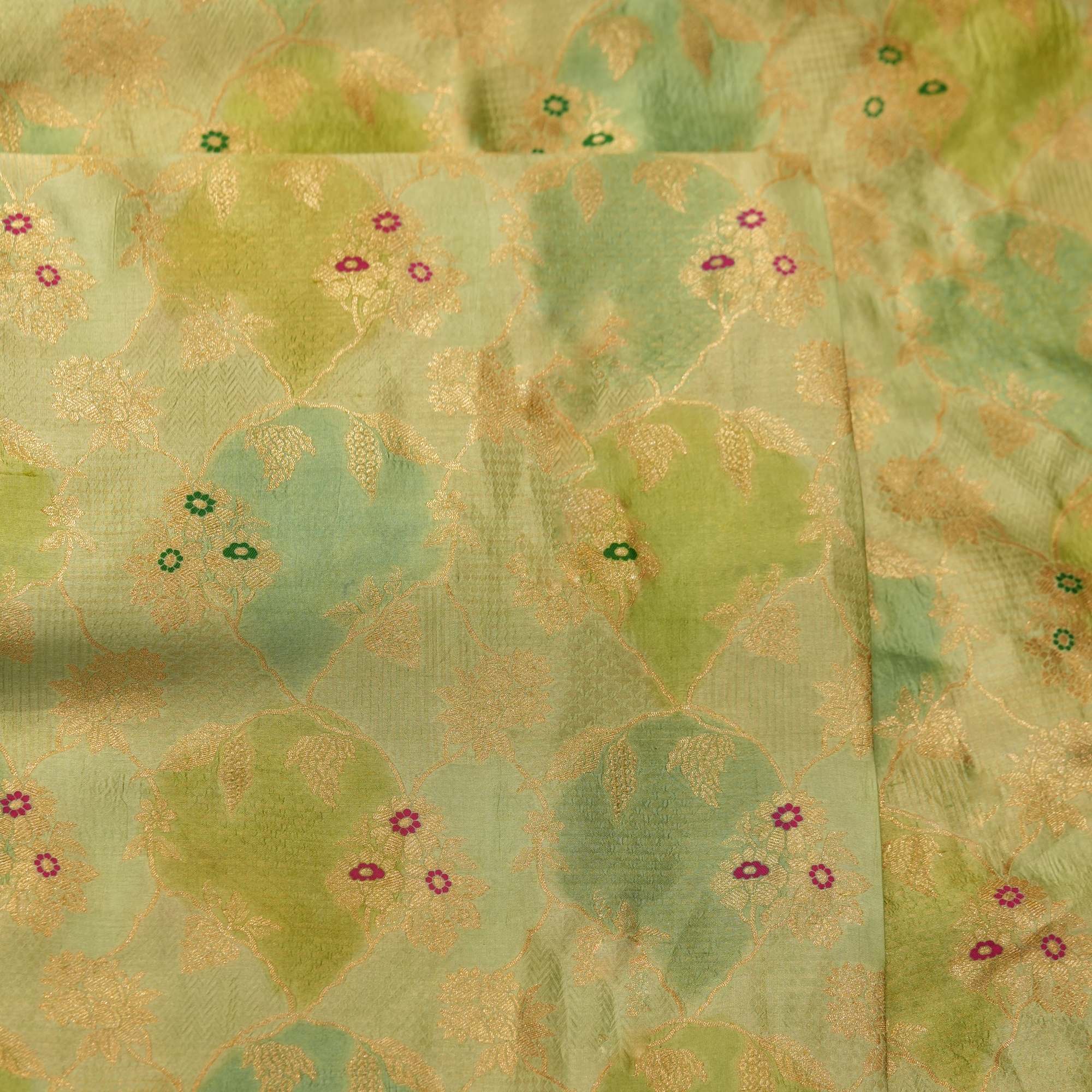Pure hand-dyed Rangkaat silk fabric in green with golden Zari jaal and colorful Meena floral accents – Gulnaar-e-Rangkaat