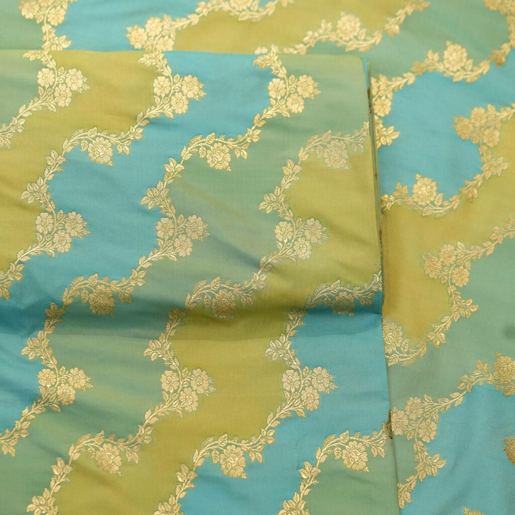 Indian hand-dyed Rangkaat silk fabric in green and aqua with golden Zari floral jaal – Bahaar-e-Rang
