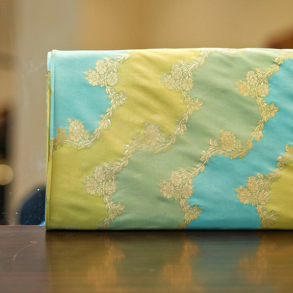 Indian hand-dyed Rangkaat silk fabric in green and aqua with golden Zari floral jaal – Bahaar-e-Rang