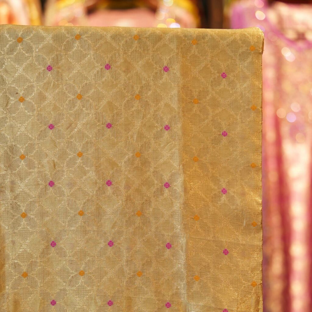 Light gold Katan silk fabric with fine Zari lattice and Meena dots – Noor-e-Katan
