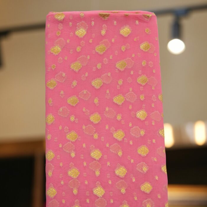 Elegant pink pure organza fabric with golden zari woven floral butas