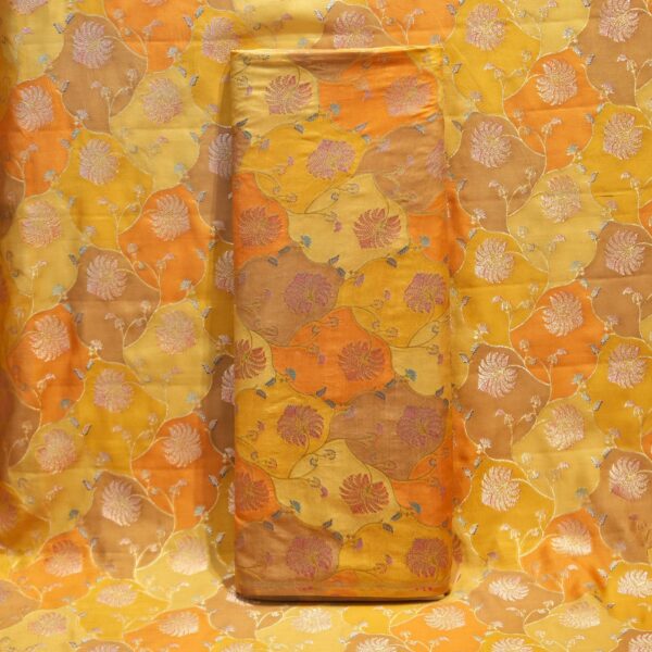 Amber orange and yellow Rangkaat silk fabric with silver and pink zari floral weave