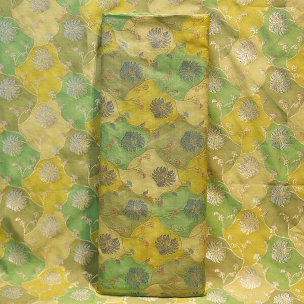 Pure silk Rangkaat fabric in green and yellow tones with silver floral zari jaal and pastel Resham details