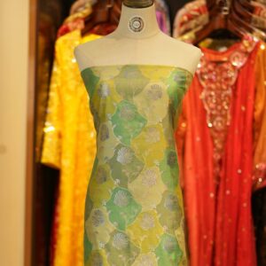 Pure silk Rangkaat fabric in green and yellow tones with silver floral zari jaal and pastel Resham details