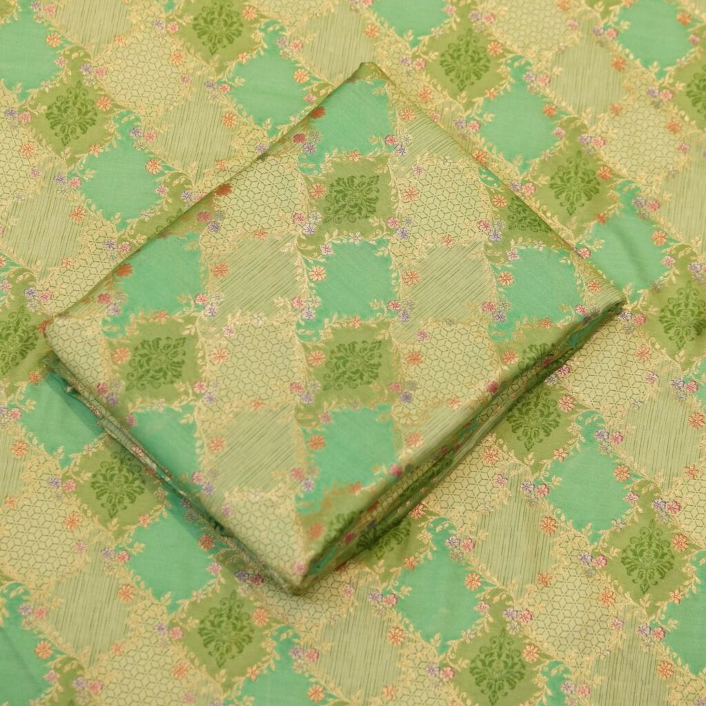 Mint green cotton jacquard fabric with golden Zari geometric weave and delicate printed florals – Firdaws-e-Zar