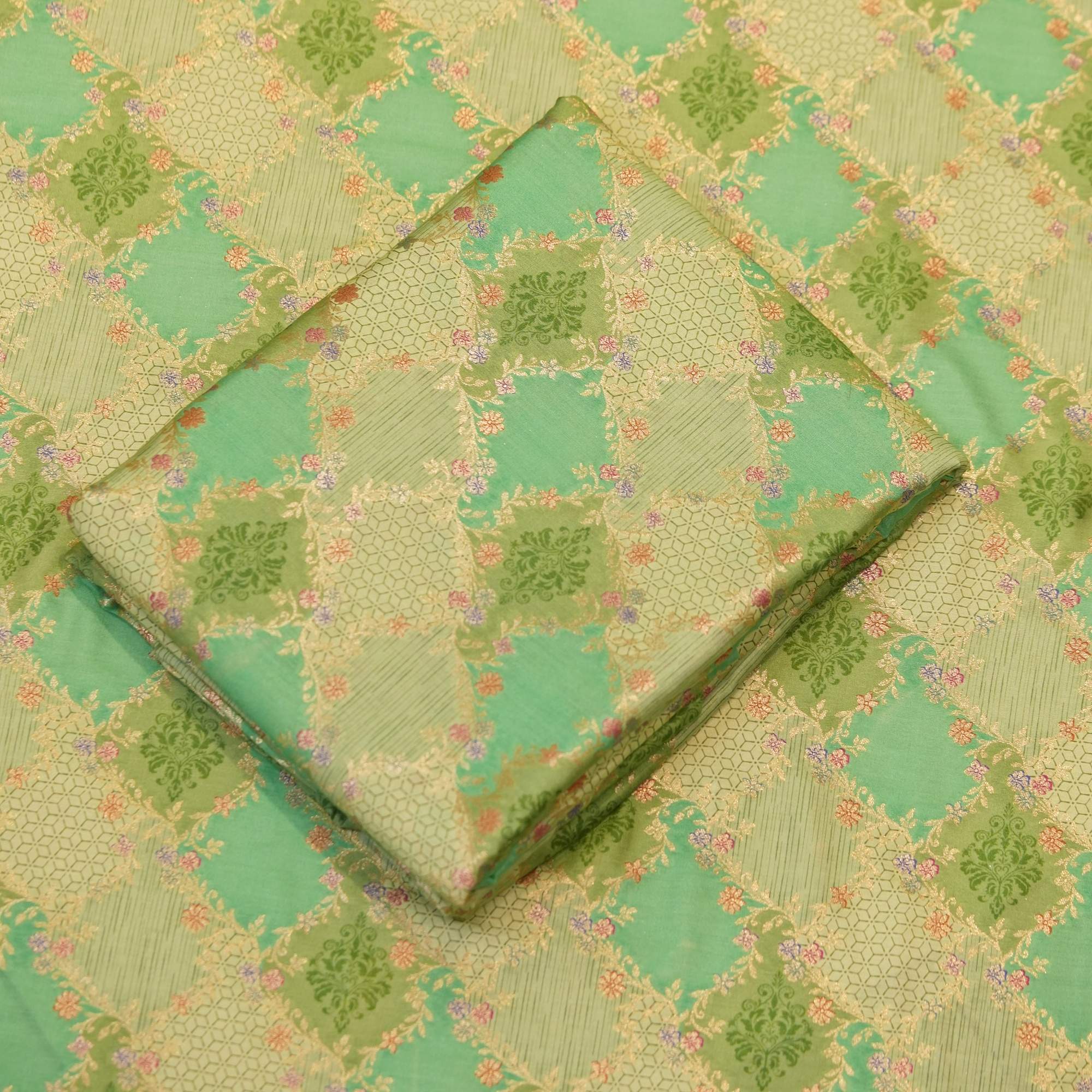 Mint green cotton jacquard fabric with golden Zari geometric weave and delicate printed florals – Firdaws-e-Zar