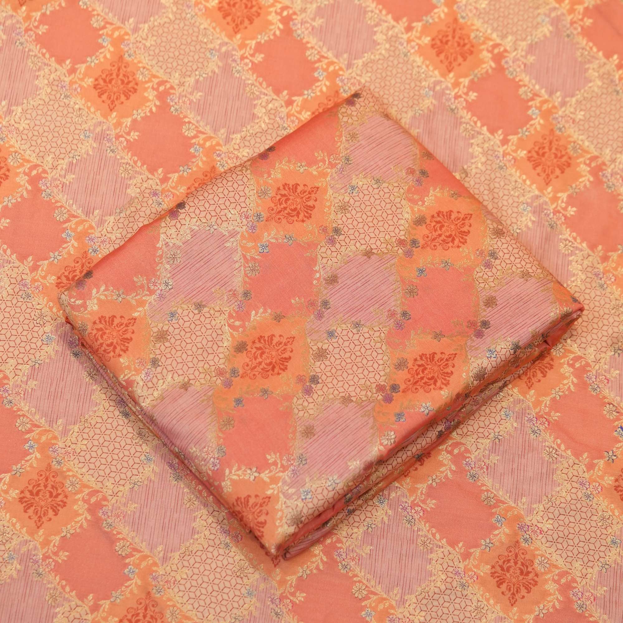 Peach-orange cotton jacquard fabric with golden Zari weave and floral printed pattern – Firdaws-e-Zar
