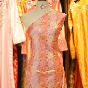 Peach-orange cotton jacquard fabric with golden Zari weave and floral printed pattern – Firdaws-e-Zar