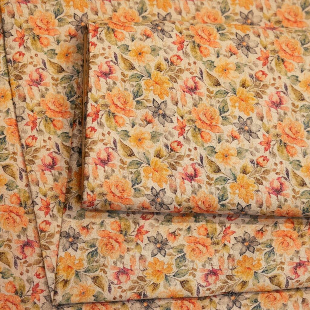 Digitally printed pure brocade silk with intricate sunset-toned floral patterns on a cream base.